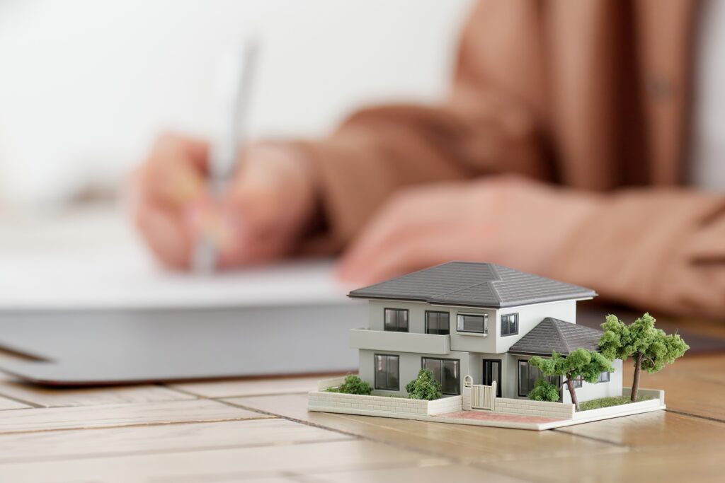 Hands of a man signing a real estate contract